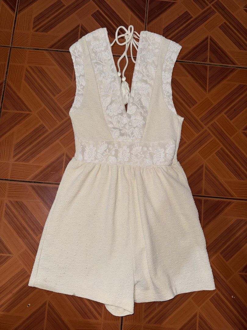Zara Cream Textured Lace Romper Size S (Category: Rompers) located in Manila. Submitted by mixi_lexi (Listing ID 1471044936, Image 1). Description: - Brand/Model: Zara Cream Romper - Size: Small - Material: Textured fabric with front embroidered lace panels - Features: Deep V-neckline, sleeveless, adjustable tassel drawstring tie at the back - Origin: Made in Turkey - Condition: Clean and in great shape.