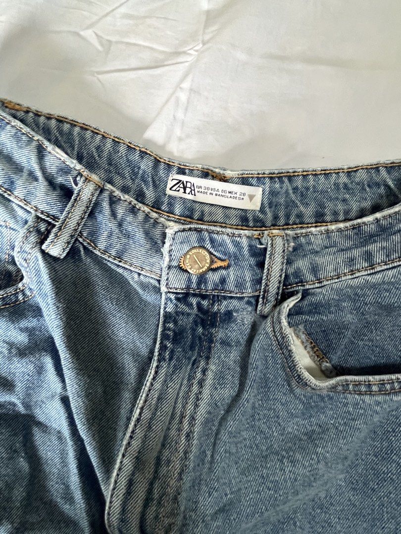 Zara Denim Shorts (Category: Shorts) located in Manila. Submitted by aaa0ki (Listing ID 1470956401, Image 2). Description: - Brand: Zara - Style: High-waisted denim shorts with classic five-pocket styling - Wash: Medium blue - Details: Button fly, metal hardware, and brown leather patch at the back waistband - Origin: Made in Bangladesh - Condition: Great wardrobe basic, perfect for warmer weather.
