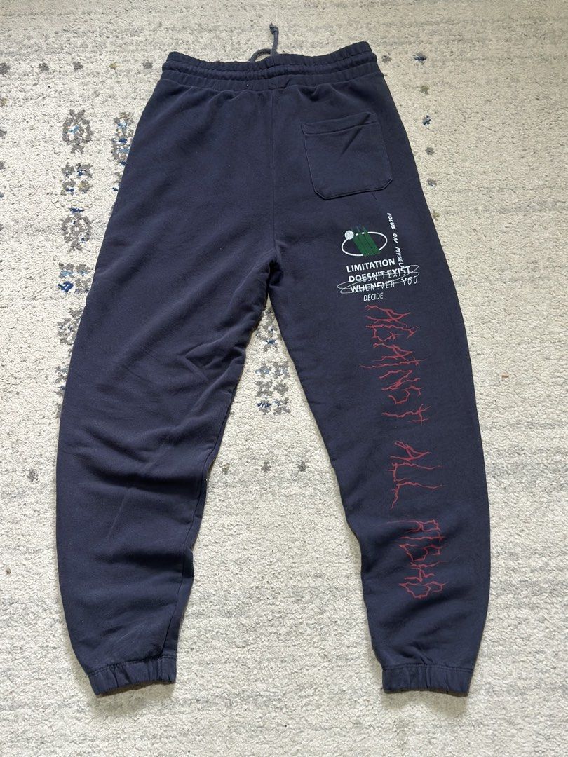 Zara Graphic Print Jogger Sweatpants (Category: Joggers) located in Daet. Submitted by thrifthings2018 (Listing ID 1471011956, Image 2). Description: - Brand: Authentic Zara - Size: Small (S) - Color: Dark Grey - Design: Assorted streetwear graphic prints and text on front and back - Fit: Elastic waistband with adjustable drawstring and ribbed ankle cuffs - Pockets: Convenient side pockets and one back pocket - Origin: Made in Turkey - Condition: