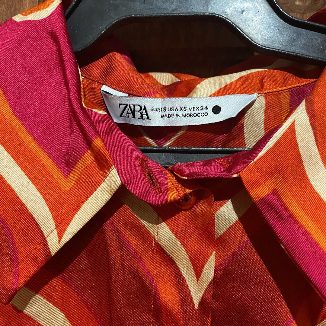 Zara Retro Pattern Copped Short Sleeve Button Up Blouse (Category: Blouses) located in Cauayan City . Submitted by edumpz (Listing ID 1471053030, Image 2). Description: - button-up shirt with retro pattern in vibrant orange, pink, and cream - collared neck, short sleeves, smooth fabric, front button closure - xs on tag but can fit small to medium - worn twice only MOP: Gcash MOD: j&t express SF shouldered by buyer 🌟 christmas .