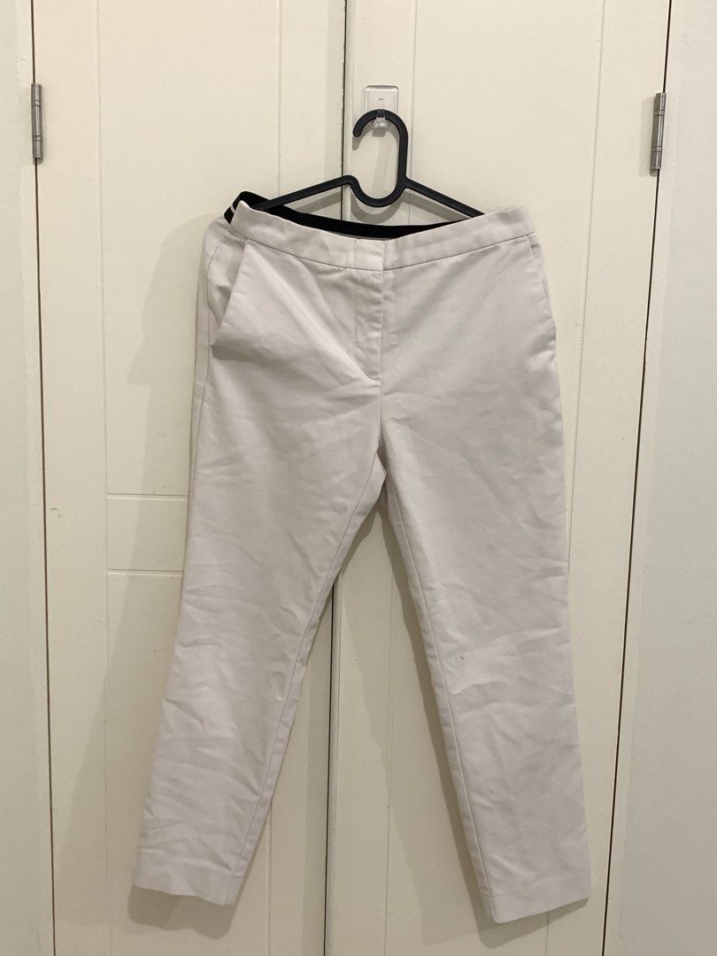 Zara White Trousers Size M (Category: Jeans) located in Pasig City. Submitted by lovedbyri (Listing ID 1471031737, Image 1). Description: - Brand: Zara - Size: M - Color: White with contrast black and white striped elastic waistband - Details: Front side pockets, back welt pockets, zip fly with hook and bar closure - Origin: Made in Turkey - Style: Clean minimalist look, easy to dress up or down for work or casual outings.