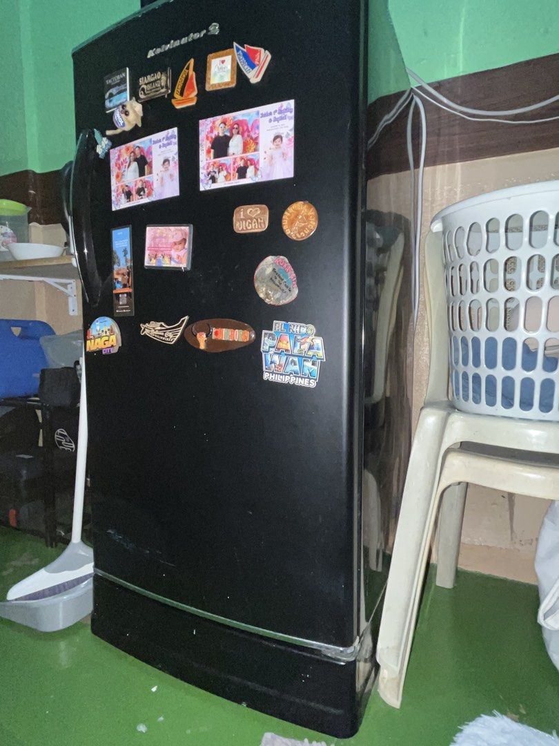 1 refrigerator with freezer and vegetable crisper (Category: Refrigerators and Freezers) located in Quezon City. Submitted by nomercy10 (Listing ID 1465623476, Image 1). Description: - Type: one-door refrigerator with upper freezer and main cooling section - Storage: Removable shelving, lower vegetable crisper drawer, and door storage bins - Features: Working interior light and side-wall temperature control dial - Condition: Clean interior with a