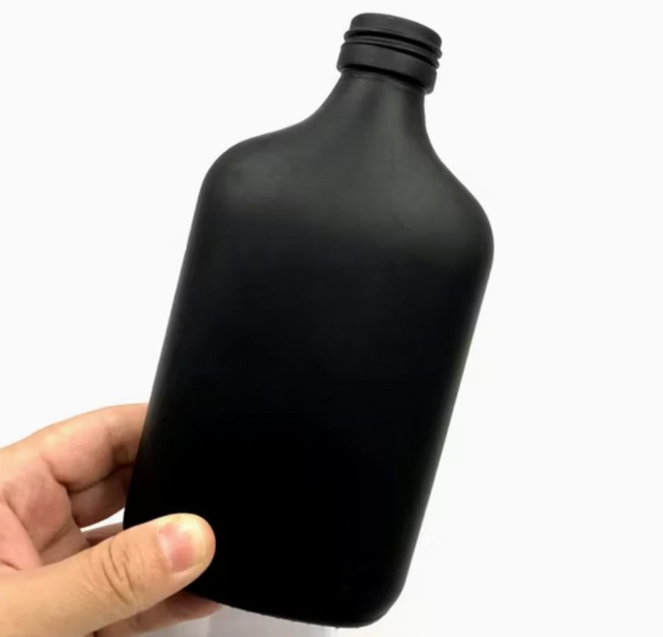 250ml Matte Black Glass Flask Bottle with Cap (Category: Water Bottles & Tumblers) located in Cebu City. Submitted by buddylimong (Listing ID 1465612982, Image 1). Description: - Matte black glass bottle with a sleek flat flask shape - Secure screw-on cap included to prevent leaks - Opaque dark finish protects contents from harmful light - Smooth frosted texture for a premium grip - Versatile container ideal for liquids, essential oils, and DIY c