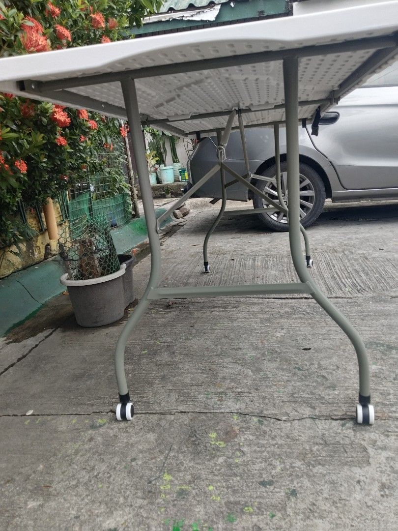 6ft White Foldable Utility Table with Wheels (Category: Tables & Sets) located in Cavite. Submitted by ambersaints (Listing ID 1465625181, Image 3). Description: - Storage: Folds down in the middle for space-saving storage and transport.