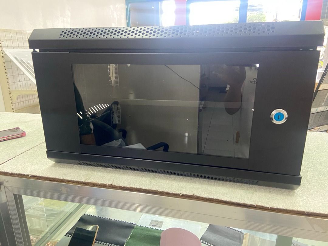 6U Wall Mount Server Rack Cabinet with Free Fixed Tray , Data Rack (Category: Shelves, Cabinets & Racks) located in Manila. Submitted by cyrenejoye (Listing ID 1465585868, Image 3). Description: - Size: 6U wall mount cabinet (530 x 400 x 300 mm) - Build: Sturdy black metal with a lockable glass front door - Cooling: Top ventilation slots to prevent overheating - Bonus: Comes with a FREE fixed tray as seen in photos - Ideal for: Organizing network