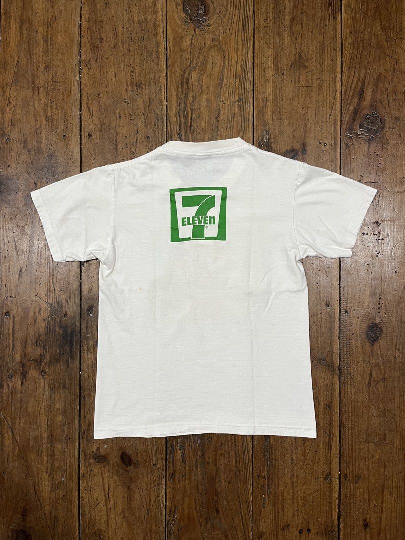 7-Eleven Logo Tee Shirt (Category: Tshirts & Polo Shirts ) located in Baguio. Submitted by fishy___fish (Listing ID 1465706301, Image 2). Description: 7-Eleven Logo Tee Shirt Tagged M Width: 17.5” Length: 23.5” Fits XS-S Has minor yellow stains (washable).