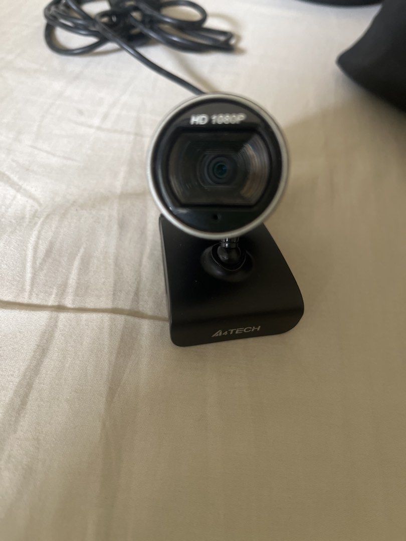 A4Tech HD 1080P Webcam (Category: Webcams) located in Makati City. Submitted by tanya29 (Listing ID 1465628006, Image 1). Description: - Brand: A4Tech - Resolution: HD 1080P for crystal clear video calls, online classes, and streaming - Design: Sleek black body with a stylish silver ring around the lens - Connectivity: Long black USB cable included - Mount: Solid desk mount for easy and stable setup - Condition: Working great and ready to use - M