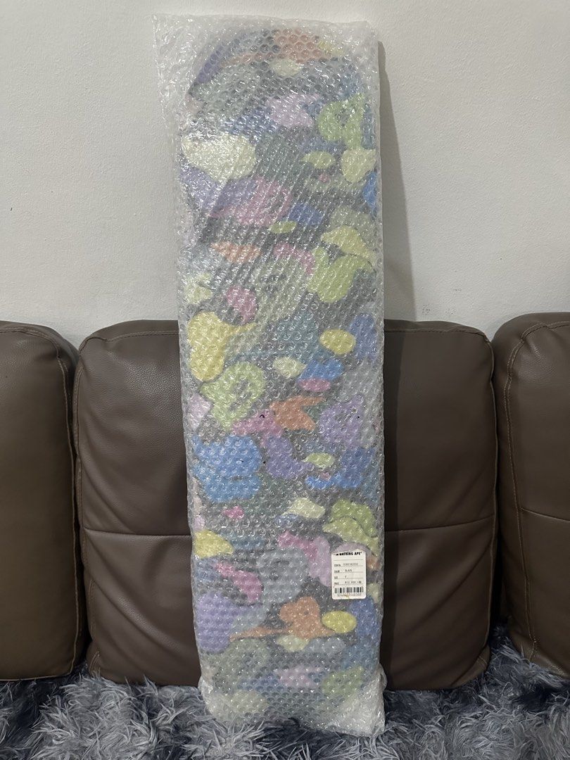 A Bathing Ape BAPE Multicolour Camo Skateboard Deck (Category: Figurines & Statues) located in Manila. Submitted by markjason420 (Listing ID 1465647242, Image 1). Description: - Authentic BAPE multicolour camo skateboard deck - Brand new and unopened, still wrapped in original bubble plastic - Original brand tag attached showing colorway and pricing details - Stored safely away from dust - Ideal for collectors or stylish wall display.