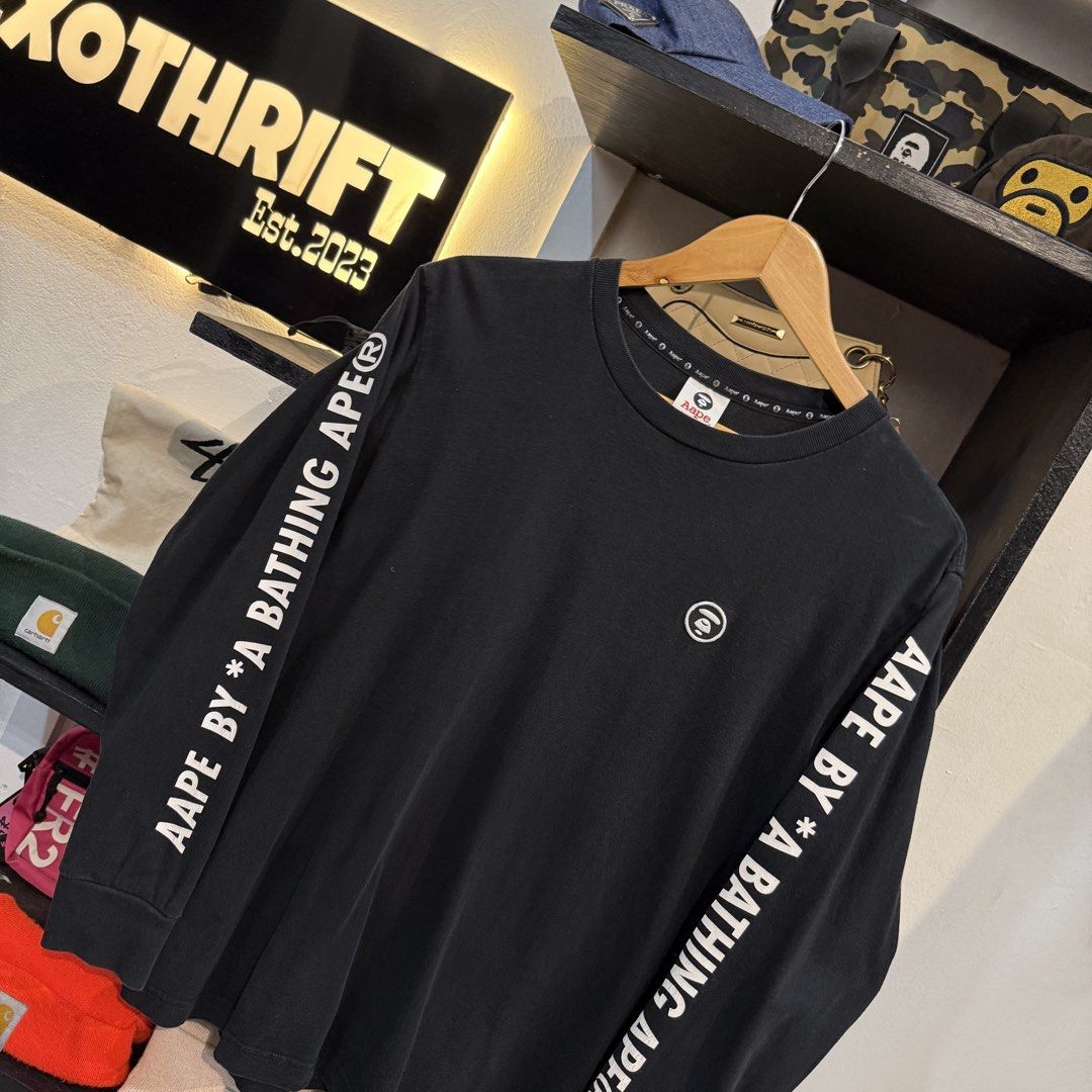 Aape By A Bathing Ape Black Long Sleeve Tee (Category: Tshirts & Polo Shirts ) located in Manila. Submitted by carbungcoalex (Listing ID 1465742477, Image 2). Description: AAPE SLEEVE SCRIPT BLACK LONGSLEEVE 20 by 26.5 Good Condition Complete tags 1500 CLAIM.