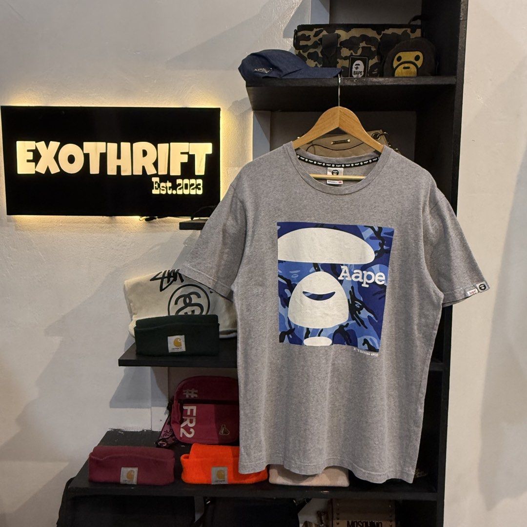 Aape By A Bathing Ape Grey T-Shirt (Category: Tshirts & Polo Shirts ) located in Manila. Submitted by carbungcoalex (Listing ID 1465755733, Image 1). Description: AAPE GREY SHIRT 20.5 by 28.5 Good Condition Complete tags 1200 CLAIM.