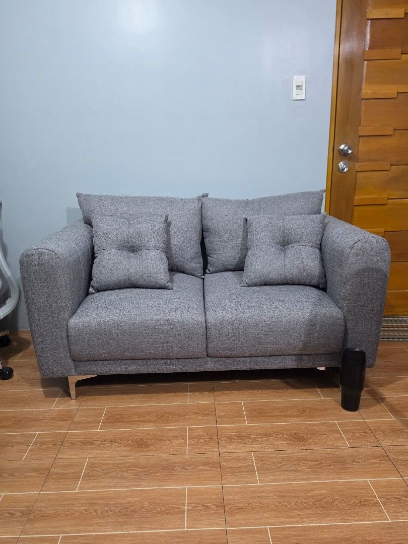 Abenson Home Shely 2-Seater Sofa Gray (Category: Sofas) located in Quezon City. Submitted by quagmire0x (Listing ID 1465714141, Image 2). Description: Selling 1 day old 2 seater sofa shelly (uratex foam) from AbensonsHome Still have official receipt Pm for video or more details. Inclusion 2 back pillow and 2 throw pillow Dimensions: (cm) Length: 152cm Width: 81cm Heigh 86cm Weight: 48kg.