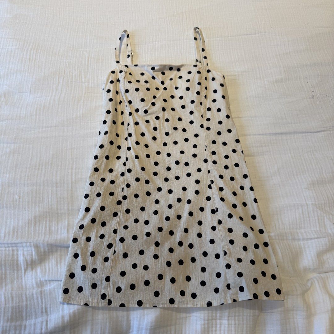 Abercrombie & Fitch Polka Dot Romper (Category: Rompers) located in Manila. Submitted by vea1992 (Listing ID 1465651364, Image 1). Description: - Brand: Abercrombie & Fitch - Size: Small - Color: Cream and black polka dot - Design: Skirt overlay with built-in shorts and bra underneath - Details: Adjustable spaghetti straps, sweetheart neckline, side zipper closure - Condition: Great piece for warm weather, brunch dates, or casual outings.