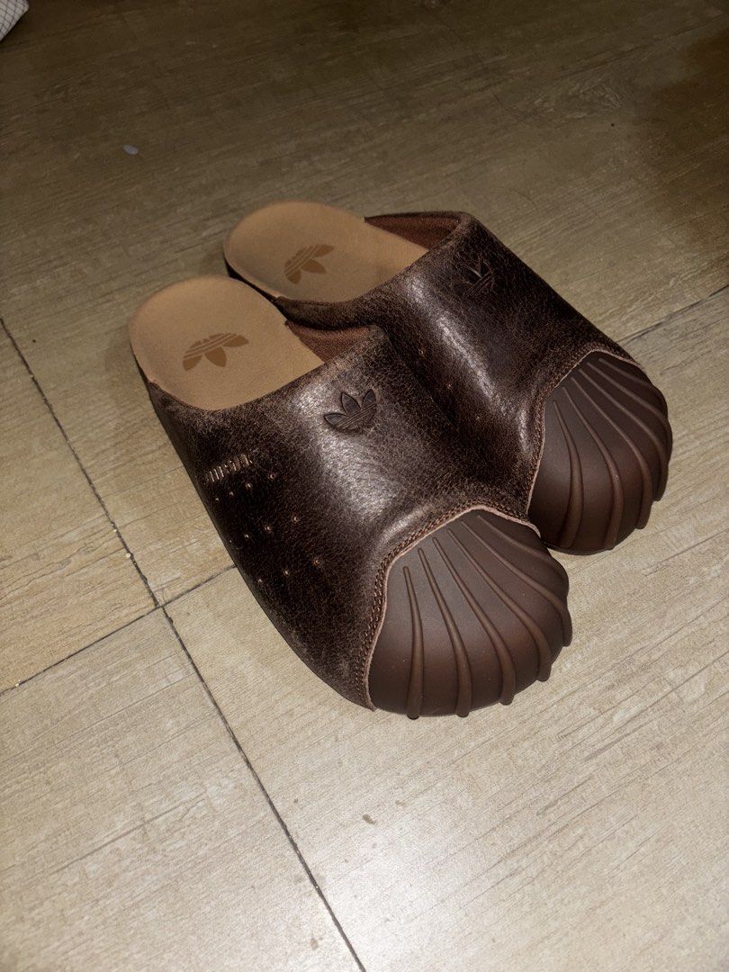 Adidas Adimule Slides Brown Leather (Category: Slippers & Slides) located in Makati City. Submitted by alienjeremy317 (Listing ID 1465585480, Image 2). Description: Adidas Adimule Slides Size 8 (26.5cm) fits 8-8.5US Original Brand New - Never used, bought in Singapore NEGOTIABLE - Color/Material: Brown pigskin leather - Comfort: Cork footbed, easy slip-on mule style - Condition: Excellent.