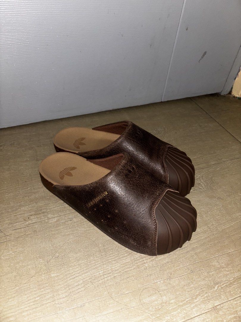 Adidas Adimule Slides Brown Leather (Category: Slippers & Slides) located in Makati City. Submitted by alienjeremy317 (Listing ID 1465585480, Image 1). Description: Adidas Adimule Slides Size 8 (26.5cm) fits 8-8.5US Original Brand New - Never used, bought in Singapore NEGOTIABLE - Color/Material: Brown pigskin leather - Comfort: Cork footbed, easy slip-on mule style - Condition: Excellent.