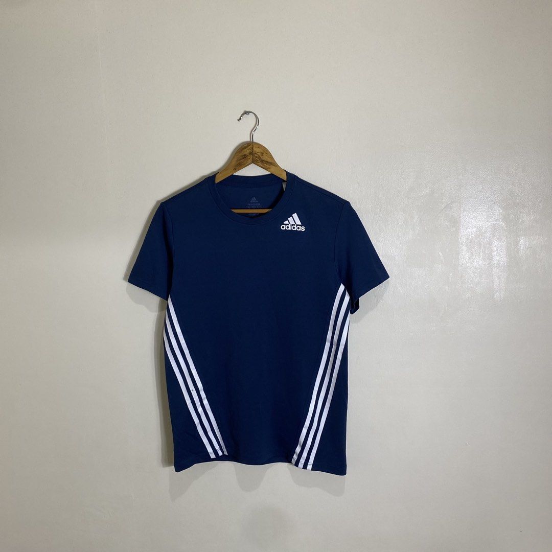 Adidas Aero 3S Tee Dark Blue Size A/M (Category: Tshirts & Polo Shirts ) located in Manila. Submitted by carbertjakosalem (Listing ID 1465754564, Image 1). Description: - 100% Authentic Adidas Aero 3S Tee in Dark Blue - Classic white 3-stripes on sides with chest logo - Primegreen recycled material with moisture-wicking Aeroready tech - Size: Asia A/M / UK L (Chest: 100cm) - Condition: Brand new / Great for gym, workout, or casual wear.