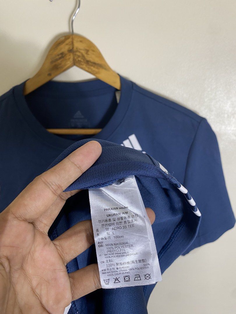 Adidas Aero 3S Tee Dark Blue Size A/M (Category: Tshirts & Polo Shirts ) located in Manila. Submitted by carbertjakosalem (Listing ID 1465754564, Image 2). Description: - 100% Authentic Adidas Aero 3S Tee in Dark Blue - Classic white 3-stripes on sides with chest logo - Primegreen recycled material with moisture-wicking Aeroready tech - Size: Asia A/M / UK L (Chest: 100cm) - Condition: Brand new / Great for gym, workout, or casual wear.
