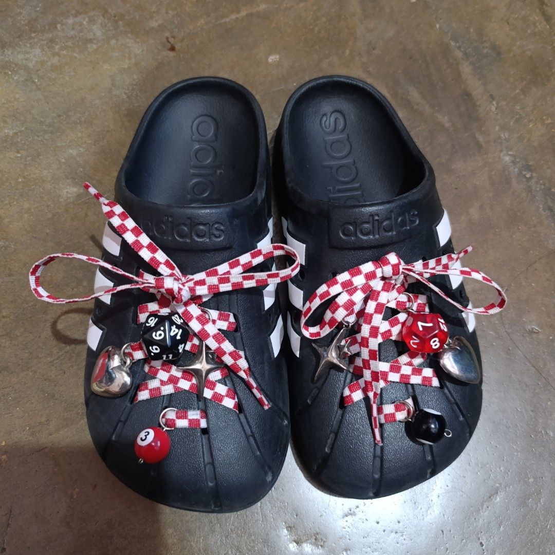Adidas Adiletta Clogs Black Crocs (Category: Slippers and slides) located in Abucay. Submitted by stripesandcheck (Listing ID 1465610780, Image 1). Description: 🔖Authentic Adidas Adiletta Clog with customized lace and charms 📌Please manage your expectations, this is a used item. No return no exchange.