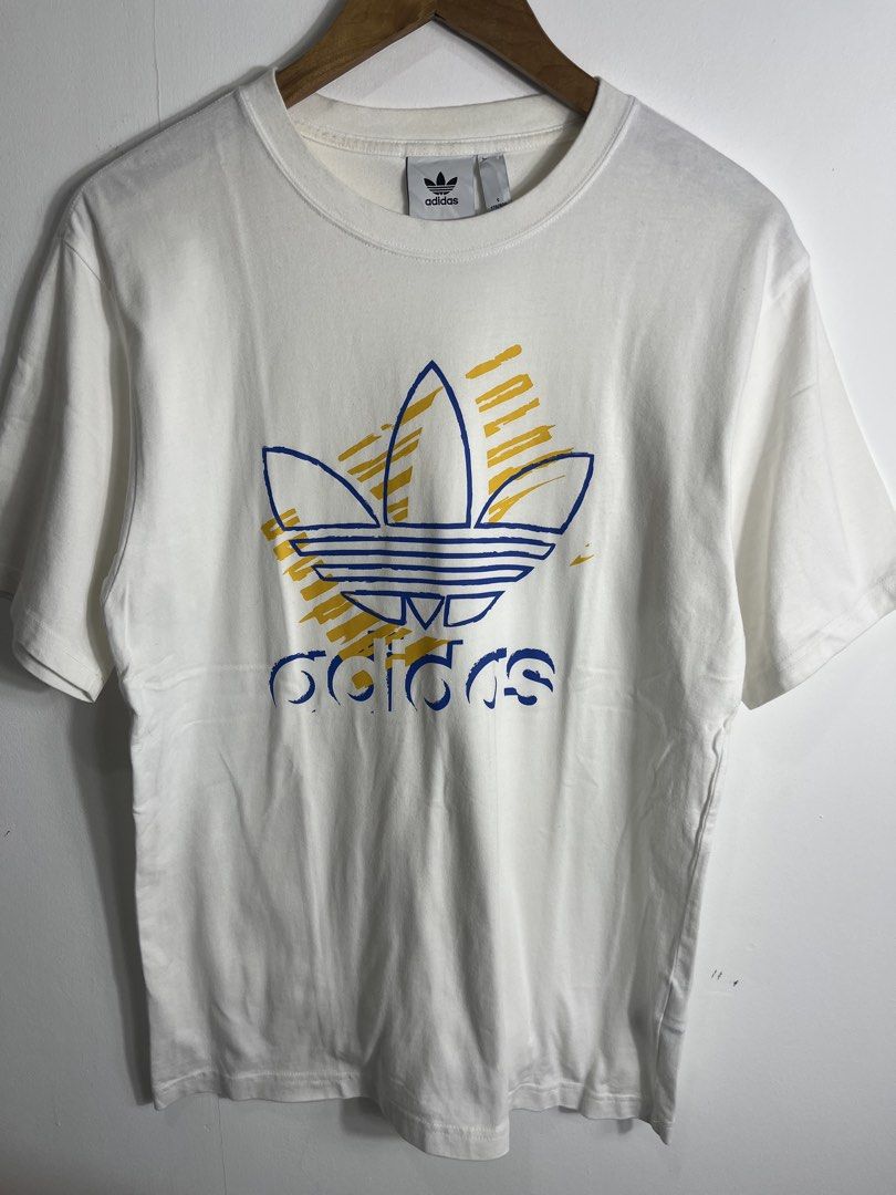 Adidas Biglogo White Shirt Medium (Category: Tshirts & Polo Shirts ) located in Nasugbu. Submitted by janstuffs.ph (Listing ID 1465589314, Image 2). Description: Adidas White Graphic Shirt Authentic 💯 Size on tag: SMALL Dimension: 19.5"W x 27"L Best fit: MEDIUM Condition: 10/10 Good as New Flaw: None Mine: 580 Thankyou po 🫶💕.