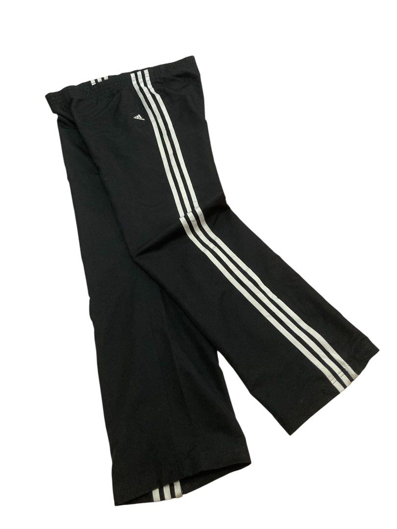 Adidas Black Track Pants with White Stripes (Category: Other Bottoms) located in Trece Martires City. Submitted by thriftkoto.91 (Listing ID 1465596461, Image 2). Description: Dimes waist 30-32” Length 38” Hem 9” - Authentic Adidas classic black track pants - Iconic white three-stripe detail on both sides - Adjustable zip cuffs at the ankles - Embroidered Adidas logo on upper left thigh - Comfortable elastic waistband with interior mesh lining - 