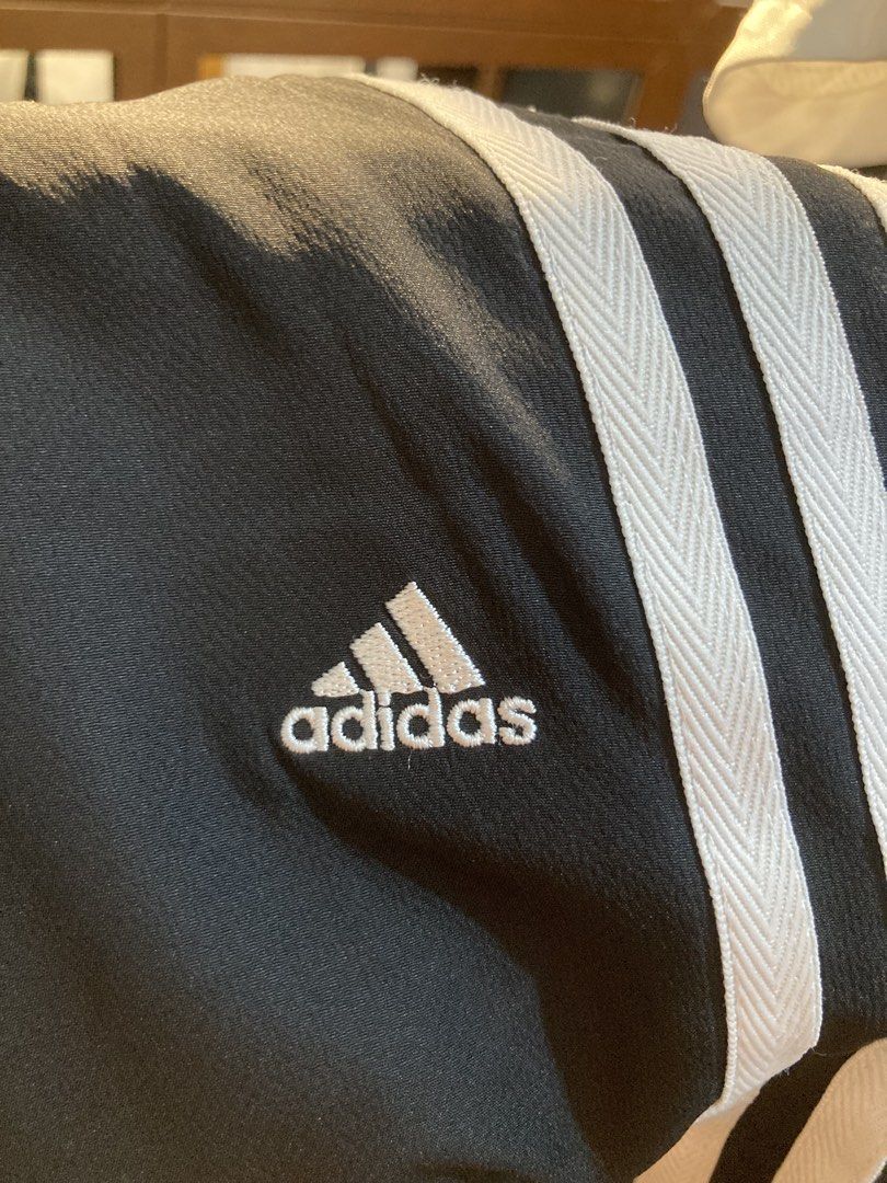 Adidas Black Track Pants with White Stripes (Category: Other Bottoms) located in Trece Martires City. Submitted by thriftkoto.91 (Listing ID 1465596461, Image 3). Description: Dimes waist 30-32” Length 38” Hem 9” - Authentic Adidas classic black track pants - Iconic white three-stripe detail on both sides - Adjustable zip cuffs at the ankles - Embroidered Adidas logo on upper left thigh - Comfortable elastic waistband with interior mesh lining - 
