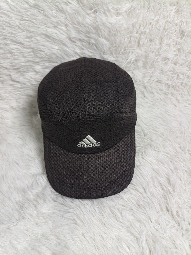 Adidas Climacool Mesh Cap (Category: Caps & Hats) located in Imus. Submitted by grindhouse.thriftshop (Listing ID 1465656049, Image 1). Description: - Color: Black with an embroidered silver Adidas logo - Technology: Climacool material keeps your head cool and dry - Material: All-over breathable mesh, super lightweight - Fit: Adjustable strap at the back for a custom fit - Condition: Excellent quality - Color Rate: 8.5/10 - Perfect for: Workouts,