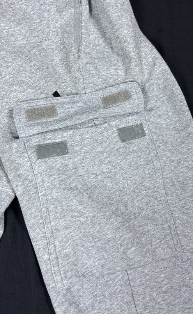 Adidas Grey Cargo Sweatpants Size 2XL (Category: Joggers) located in Bacoor. Submitted by calvinmanzano13 (Listing ID 1465617191, Image 3). Description: - L = 40.5” | W = 37” - Origin: Made in Cambodia - Features: Cargo pockets on both sides with Velcro closures - Logo: Embroidered black logo under the left pocket - Fit: Adjustable drawstring waistband and ribbed ankle cuffs Notes: ☑️ Hand washed ☑️ Polished ☑️ Steam ironed.