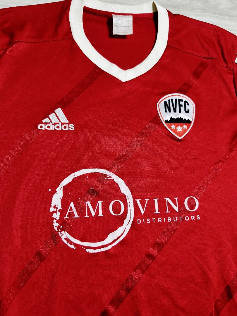 Adidas NVFC Football Jersey (Category: Activewear) located in Paranaque City. Submitted by pickersform (Listing ID 1465704542, Image 2). Description: - Adidas NVFC Jersey - Size: Medium-Large dimes 22x29 - Details: NVFC chest crest, Amo Vino Distributors sponsor logo, and number 9 on the back - Material: Climalite fabric for moisture management - embroidered logos minor crack on white print and minor lints only unnoticeable .