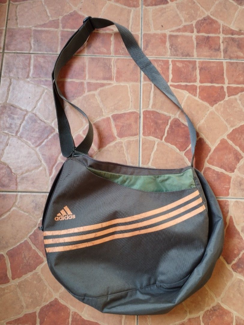 Adidas Shoulder/Cross Body Bag (Category: Sling Bags) located in San Fernando. Submitted by nerosales (Listing ID 1465245825, Image 1). Description: Adidas Shoulder/Cross Body Bag approximately 15 x 12 inches Please see all photos for condition. 450 pesos only SM City Pampanga Shipping: J&T Payment: Gcash NO COD /NO COP.