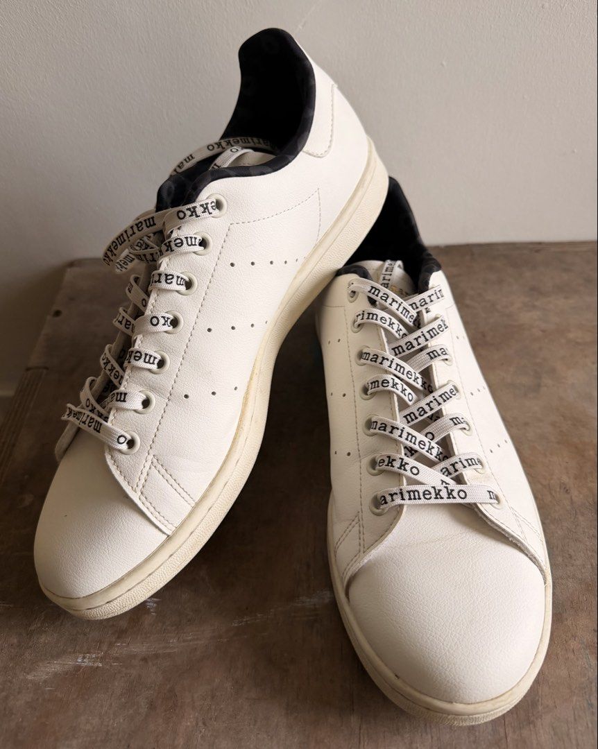 Adidas Stan Smith Marimekko White Black Sneakers (Category: Sneakers) located in Quezon City. Submitted by iwentrogue (Listing ID 1465620925, Image 2). Description: - Brand: Adidas x Marimekko Stan Smith - Size: US 11 / UK 10 / EUR 44 2/3 - Color: White leather upper with black details - Special Features: Distinctive Marimekko lettering laces, iconic floral poppy heel tab, and patterned inner lining - Inclusion: Original shoebox included - Condit