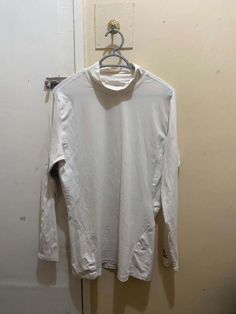 Adidas Techfit ClimaCool Long Sleeve White Compression Shirt (Category: Activewear) located in Manila. Submitted by tiyofindz (Listing ID 1465666723, Image 1). Description: THRIFTED!! - Brand: Adidas - Style: Techfit Long Sleeve Compression Top - Color: White/Dirty White (color rate: 8.5/10) - Technology: ClimaCool for breathability and moisture management - Design: Mock neck with signature branding on collar and lower sleeve MODEL REFERENCE: 5'7