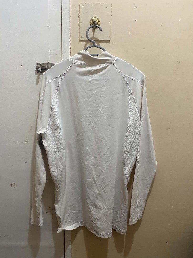 Adidas Techfit ClimaCool Long Sleeve White Compression Shirt (Category: Activewear) located in Manila. Submitted by tiyofindz (Listing ID 1465666723, Image 3). Description: THRIFTED!! - Brand: Adidas - Style: Techfit Long Sleeve Compression Top - Color: White/Dirty White (color rate: 8.5/10) - Technology: ClimaCool for breathability and moisture management - Design: Mock neck with signature branding on collar and lower sleeve MODEL REFERENCE: 5'7