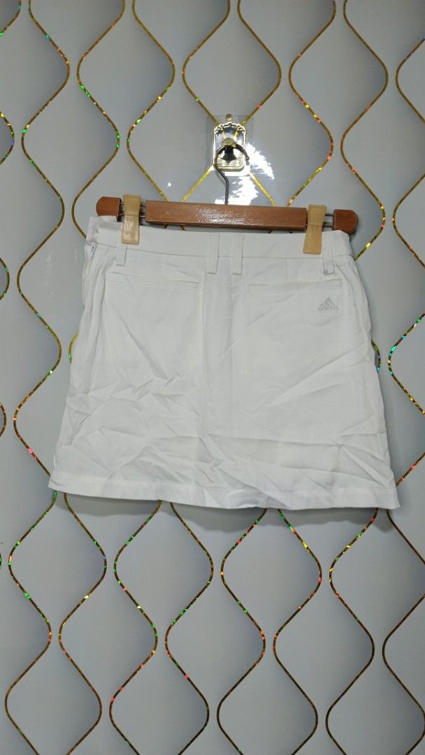 Adidas White Pleated Skort (Category: Skirts) located in Manila. Submitted by zariyah.1986 (Listing ID 1465625779, Image 2). Description: - Brand: Adidas - Item: White pleated skort with built-in shorts - Size: S (Waist: 27×14) - Details: Back pockets with embroidered Adidas logo, made in China - Versatile: Great for sports, workouts, or casual everyday outfits - Condition: Excellent.