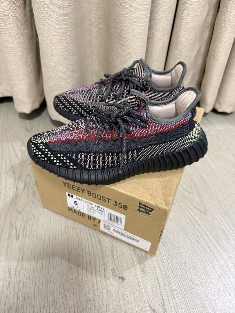 Adidas Yeezy Boost 350 V2 Yecheil Non-Reflective (Category: Sneakers) located in Manila. Submitted by chanelmari19 (Listing ID 1465755913, Image 1). Description: Adidas Yeezy Boost 350 V2 sneakers in the Yecheil colourway. Multi-coloured Primeknit upper combining black, red, blue, and yellow accents. Ribbed black midsole housing Boost cushioning. Includes original cardboard shoebox with size label showing US size 6. Dark reflective-style laces th