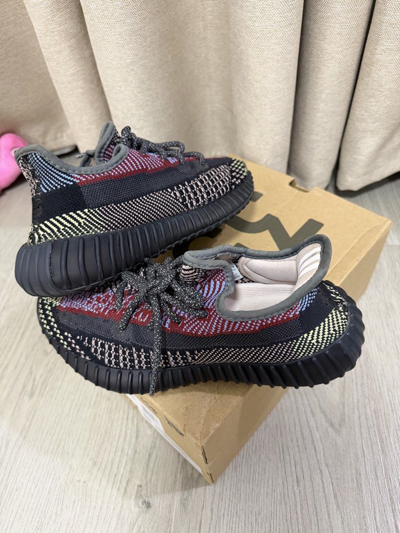 Adidas Yeezy Boost 350 V2 Yecheil Non-Reflective (Category: Sneakers) located in Manila. Submitted by chanelmari19 (Listing ID 1465755913, Image 3). Description: Adidas Yeezy Boost 350 V2 sneakers in the Yecheil colourway. Multi-coloured Primeknit upper combining black, red, blue, and yellow accents. Ribbed black midsole housing Boost cushioning. Includes original cardboard shoebox with size label showing US size 6. Dark reflective-style laces th