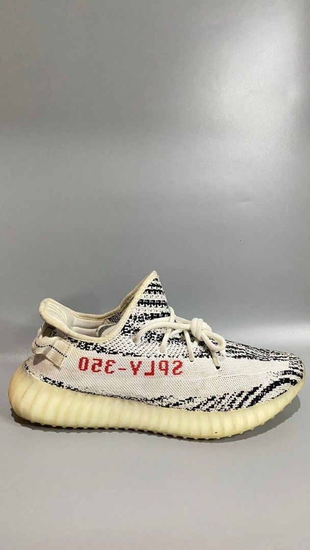 Adidas Yeezy Boost 350 V2 Zebra (Category: Sneakers) located in Manila. Submitted by mommyregsthriftclothes (Listing ID 1465640923, Image 1). Description: - Model: Adidas Yeezy Boost 350 V2 - Colorway: Zebra (White/Black with red SPLY-350 branding) - Sole: Comfortable Boost midsole with translucent ribbed rubber outsole - Details: White rope laces, classic Kanye West collaboration silhouette - Condition: Brand new / ready for your sneaker rotatio
