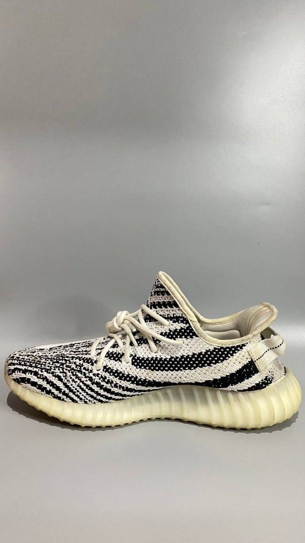 Adidas Yeezy Boost 350 V2 Zebra (Category: Sneakers) located in Manila. Submitted by mommyregsthriftclothes (Listing ID 1465640923, Image 2). Description: - Model: Adidas Yeezy Boost 350 V2 - Colorway: Zebra (White/Black with red SPLY-350 branding) - Sole: Comfortable Boost midsole with translucent ribbed rubber outsole - Details: White rope laces, classic Kanye West collaboration silhouette - Condition: Brand new / ready for your sneaker rotatio