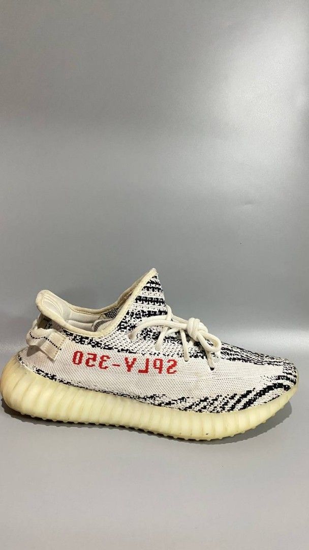 Adidas Yeezy Boost 350 V2 Zebra (Category: Sneakers) located in Manila. Submitted by mommyregsthriftclothes (Listing ID 1465640923, Image 3). Description: - Model: Adidas Yeezy Boost 350 V2 - Colorway: Zebra (White/Black with red SPLY-350 branding) - Sole: Comfortable Boost midsole with translucent ribbed rubber outsole - Details: White rope laces, classic Kanye West collaboration silhouette - Condition: Brand new / ready for your sneaker rotatio