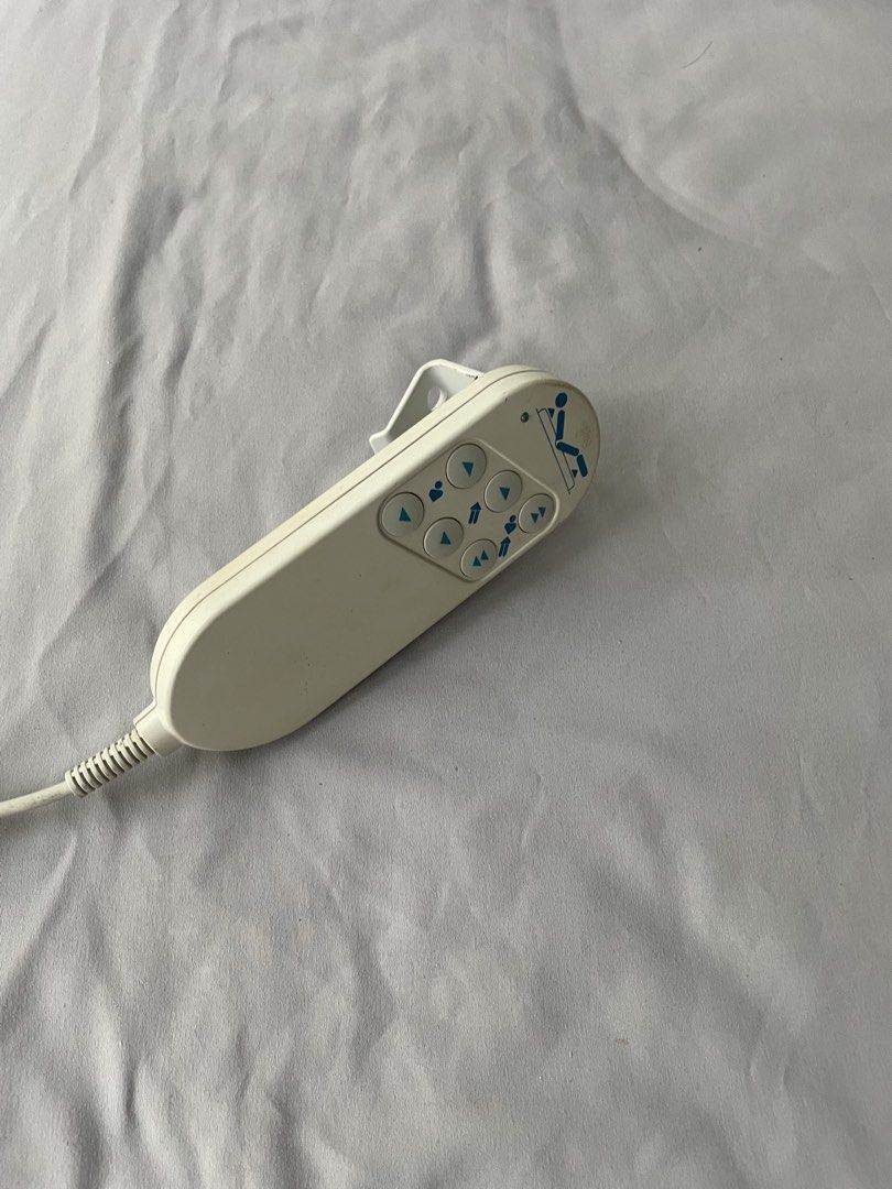 Adjustable bed with controller (Category: Bed Frames & Mattresses) located in Singapore. Submitted by val1616_house (Listing ID 1465735949, Image 1). Description: Remote control for adjustable medical bed. Features easy-to-use blue arrow buttons, a standard coiled cable, and a convenient hanging clip for bed rails. Fully functional and ready to use..