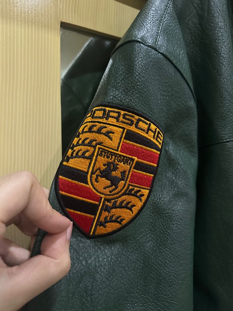Aimé Leon Dore x Porsche Leather Jacket (Category: Coats, Jackets and Outerwear) located in Antipolo. Submitted by YRKs_Store (Listing ID 1465623852, Image 3). Description: Aimé Leon Dore x Porsche Inspired Leather jacket by Running Cheetahs - Heavyweight leather with quilted black inner lining - Front & Back: Large embroidered Porsche crest patch and ALD branding - Sleeve: Aimé Leon Dore 993 embroidery and Porsche shield patch - Trims: Yellow an