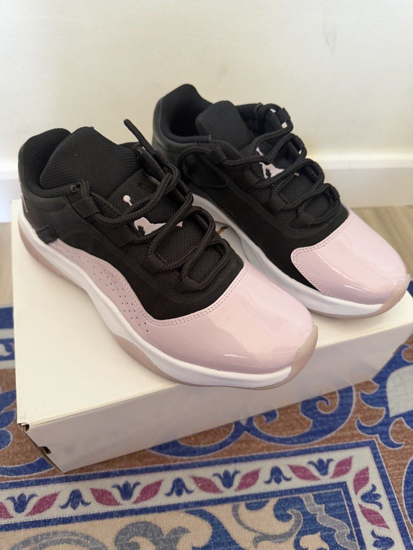 Air Jordan 11 CMFT Low Black Pink (Category: Sneakers) located in Manila. Submitted by anonymous123.149 (Listing ID 1465676480, Image 1). Description: - Model: Jordan 11 CMFT Low - Colorway: Black and soft pink - Features: Patent leather toe cap, breathable mesh upper, and classic Jumpman logo on tongue and heel - Soles: White midsole with pinkish translucent rubber outsole sections - Condition: Like new, clean soles, zero wear on tread, laces in