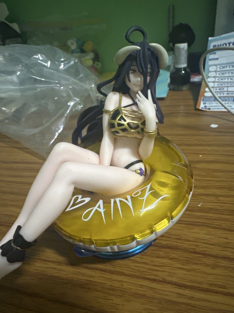 Albedo Overlord Figure Swimsuit Float Version (Category: Figurines & Statues) located in Manila. Submitted by silentfire.54ea36 (Listing ID 1465750775, Image 1). Description: - Character: Albedo from Overlord - Outfit: Detailed black and gold swimsuit with long dark purple hair and horns - Pose: Cute pose with hand near face - Accessory: Yellow inflatable float ring - Condition: Unboxed / Displayed condition - Perfect for anime figure collectors!
