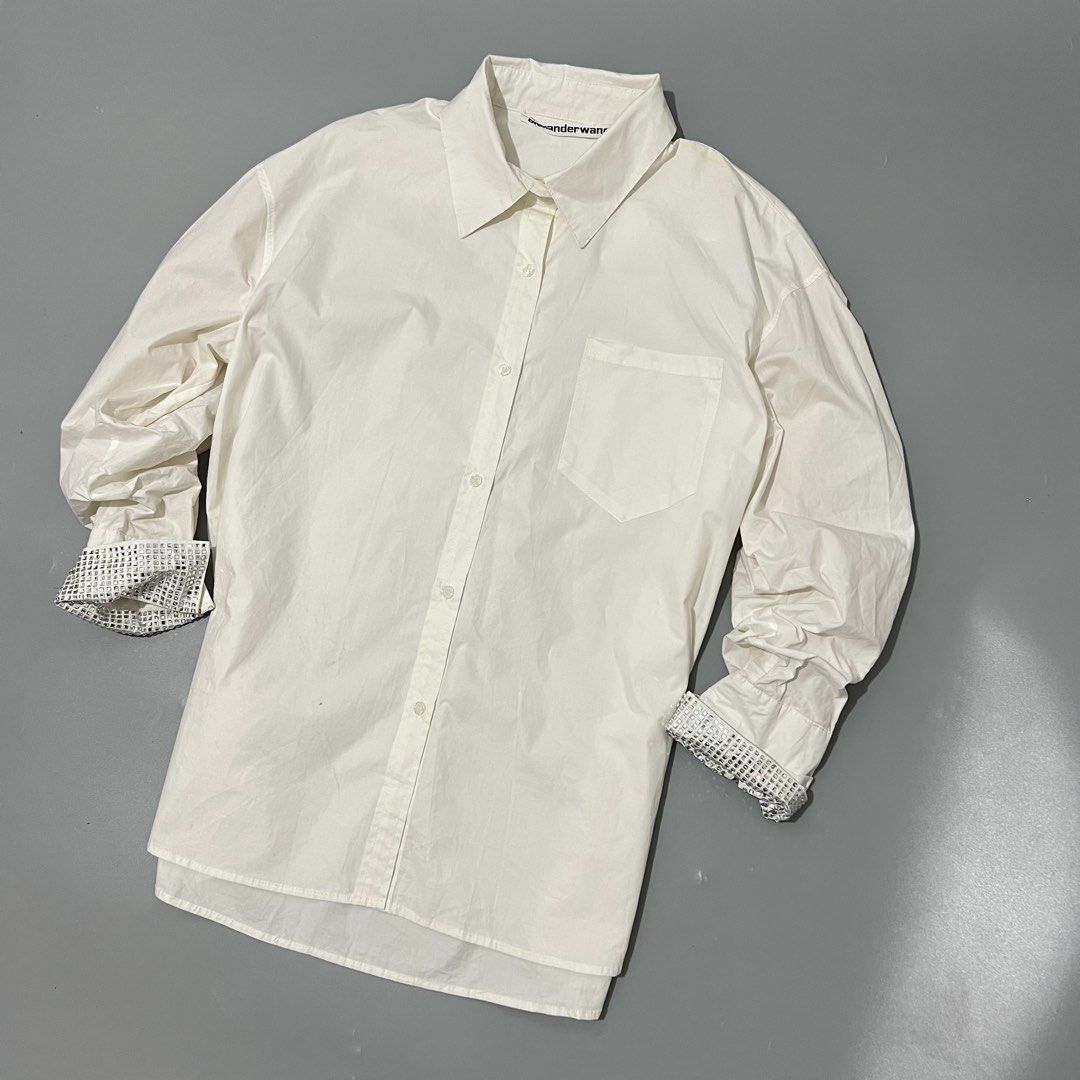 Alexander Wang - Shirt - Crystal Cuffs (Category: Shirts) located in Cavite. Submitted by asianluxe (Listing ID 1465702100, Image 2). Description: ALEXANDERWANG-SHIRT-CRYSTAL CUFFS FLAT MEASUREMENTS! Length:29 inches Width:23.5 Shoulder to shoulder:22 inches Sleeve:17 inches Hem: 24 inches (Guaranteed authentic) Good condition Very presentable 9/10 condition Flaw: Check the pics need wash! But still good condition Composition! 100% Cotton.