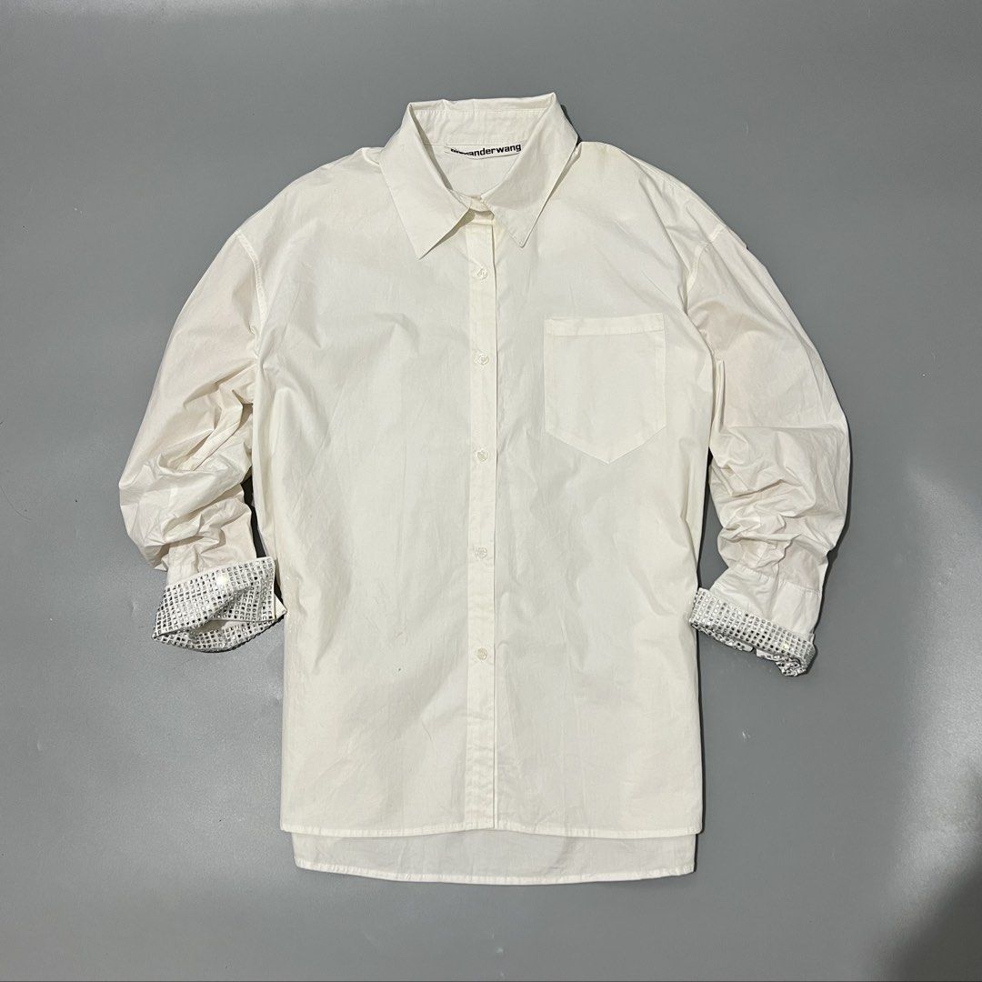 Alexander Wang - Shirt - Crystal Cuffs (Category: Shirts) located in Cavite. Submitted by asianluxe (Listing ID 1465702100, Image 1). Description: ALEXANDERWANG-SHIRT-CRYSTAL CUFFS FLAT MEASUREMENTS! Length:29 inches Width:23.5 Shoulder to shoulder:22 inches Sleeve:17 inches Hem: 24 inches (Guaranteed authentic) Good condition Very presentable 9/10 condition Flaw: Check the pics need wash! But still good condition Composition! 100% Cotton.