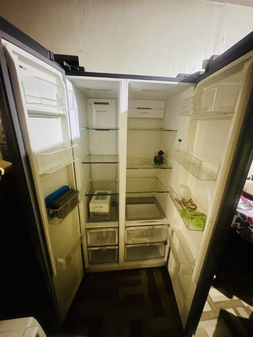 American Home Inverter Side by Side Refrigerator (Category: Refrigerators and Freezers) located in Pasay City. Submitted by jen_valenzuela (Listing ID 1465656085, Image 3). Description: - Brand/Model: American Home Side-by-Side Refrigerator - Color: Dark Grey - Features: Digital temperature display, multi-shelf interior, door bins, vegetable crispers, and energy-saving inverter technology - Condition: Super clean inside and out, well-maintained -