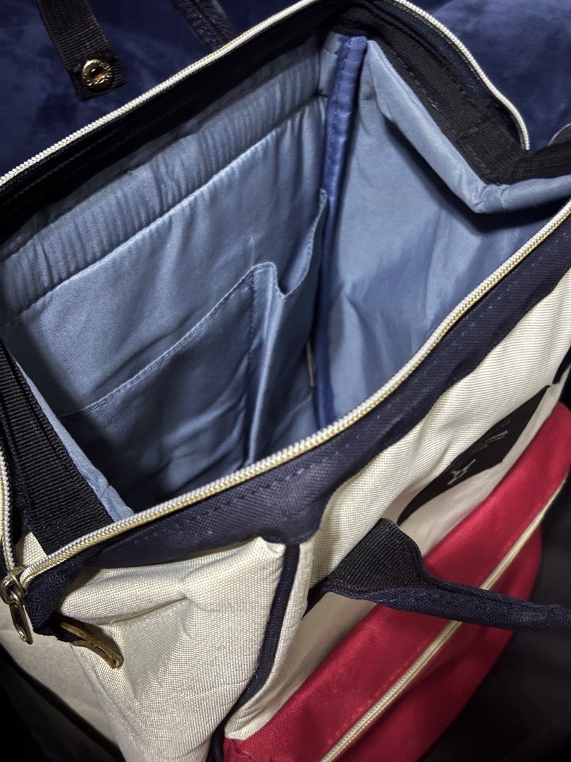 Anello Kuchigane Tri-Color Multi-Color Canvas Bag Backpack (Category: Backpacks) located in Pulilan. Submitted by shane_malik (Listing ID 1465623786, Image 3). Description: PRE-LOVED ANELLO BACKPACK bought last year, seldom used (negotiable) - Brand: Anello - Style: Canvas backpack in cream, navy blue, and red color block - Handles: Double top handles with snap button closure - Straps: Comfortable padded shoulder straps - Access: Handy back zip a