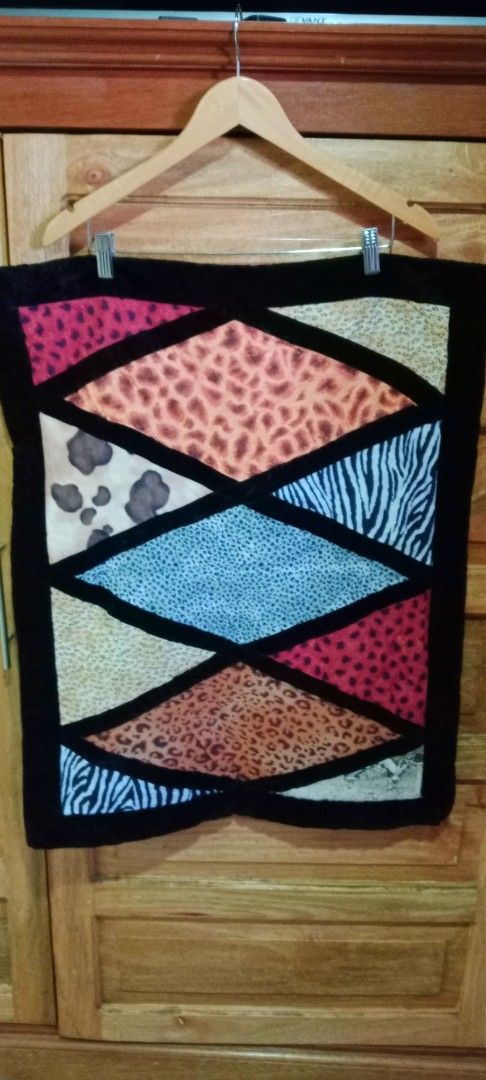 Animal Print Patchwork Quilt Pillowcase (Category: Bedding & Towels) located in Mangaldan. Submitted by closetqwin (Listing ID 1465648854, Image 1). Description: - Never been used -Size 29.5 inches Length and 23.5 inches Width -Eye-catching pillowcase featuring mixed animal prints (leopard, zebra, cow) in diamond and triangle patches - Framed with sleek black velvet borders for a modern, stylish look .