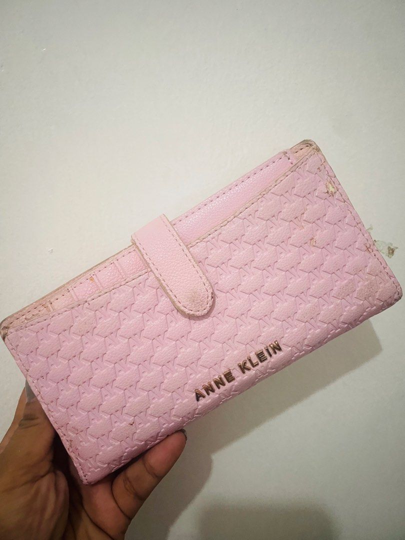 Anne Klein Pink Monogram Long Wallet With Removable Card Holder (Category: Wallets & Card holders) located in Antipolo. Submitted by emillauren (Listing ID 1465587971, Image 1). Description: - Brand: Anne Klein - Color: Pink with tan interior lining - Material/Design: Debossed AK monogram pattern with gold-tone metal lettering - Closure: Snap closure strap - Interior Features: Multiple card slots and a secure zippered compartment - Extras: Includ