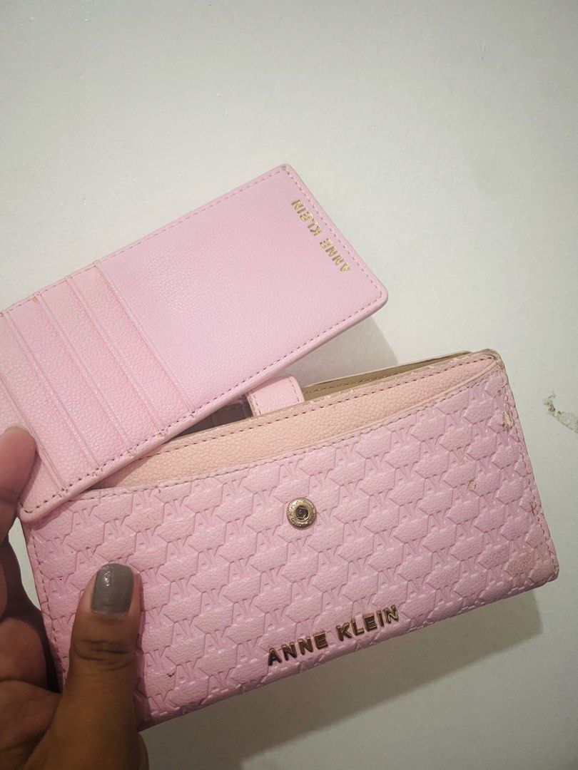 Anne Klein Pink Monogram Long Wallet With Removable Card Holder (Category: Wallets & Card holders) located in Antipolo. Submitted by emillauren (Listing ID 1465587971, Image 3). Description: - Brand: Anne Klein - Color: Pink with tan interior lining - Material/Design: Debossed AK monogram pattern with gold-tone metal lettering - Closure: Snap closure strap - Interior Features: Multiple card slots and a secure zippered compartment - Extras: Includ