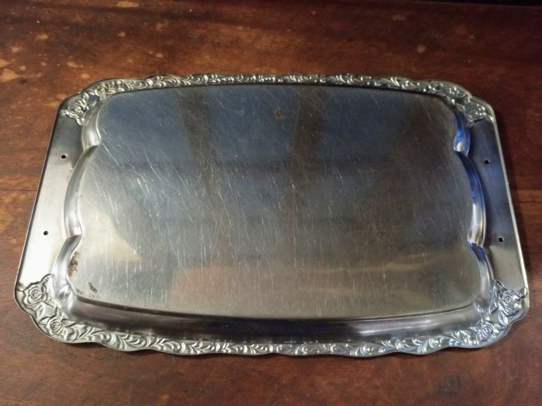 Vintage Silver Plated Floral Design Serving Tray (Category: Dinnerware & Cutlery) located in Quezon City. Submitted by blacked.market (Listing ID 1465699069, Image 2). Description: Dimensions: Length -11.5 inches Width -18 inches Notes: - Has scratches due to usage - Missing Handle - Slightly Bent (Nomal due to type of metal which flex) -Needs to be polished Mode of Payment: Gcash/Cash Preferred Meetup Place: Puregold North Commonwealth Pickup De