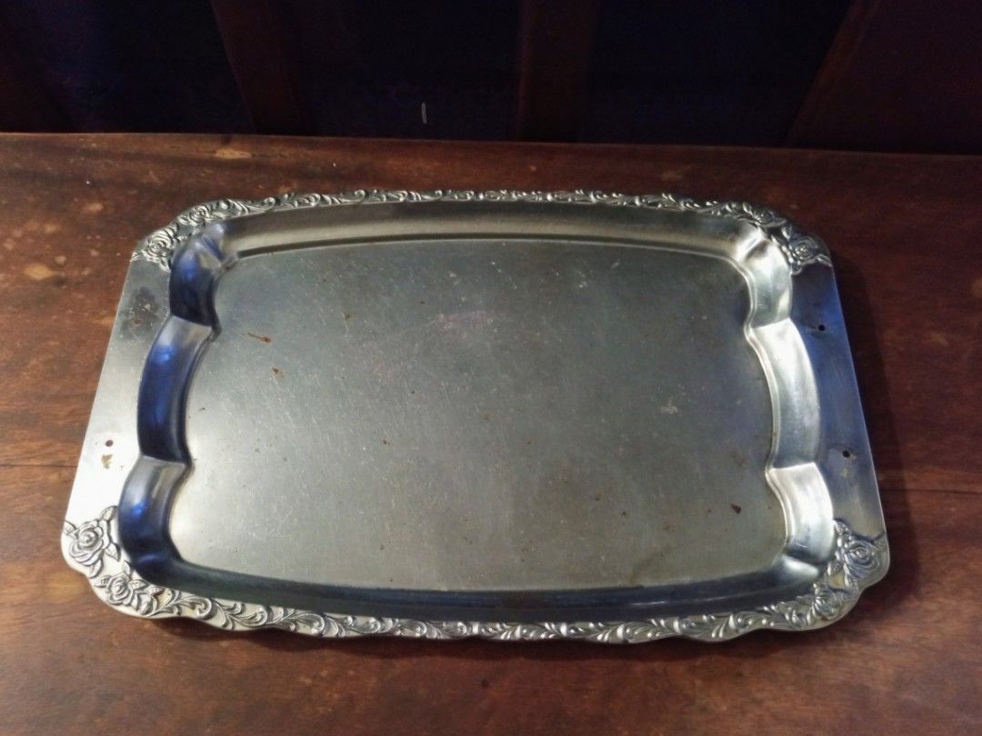 Vintage Silver Plated Floral Design Serving Tray (Category: Dinnerware & Cutlery) located in Quezon City. Submitted by blacked.market (Listing ID 1465699069, Image 1). Description: Dimensions: Length -11.5 inches Width -18 inches Notes: - Has scratches due to usage - Missing Handle - Slightly Bent (Nomal due to type of metal which flex) -Needs to be polished Mode of Payment: Gcash/Cash Preferred Meetup Place: Puregold North Commonwealth Pickup De